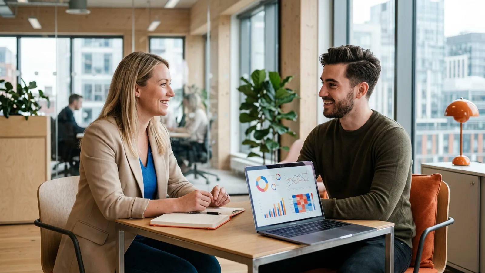 KORE1 data science recruiter meeting with a data scientist candidate in a bright modern analytics office