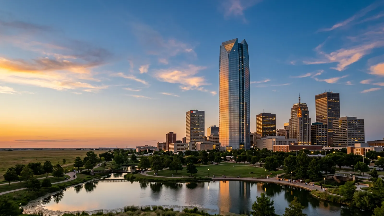 Downtown Oklahoma City skyline at dusk under a wide prairie sky, the setting for KORE1 IT staffing across the OKC metro