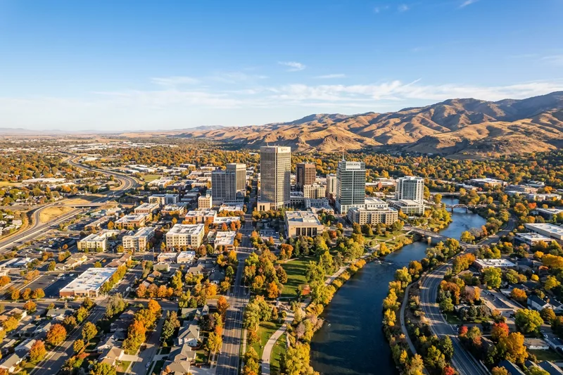 Aerial daytime view of the Treasure Valley with downtown Boise the Boise Foothills and the Owyhee mountains in the background on a clear Idaho morning