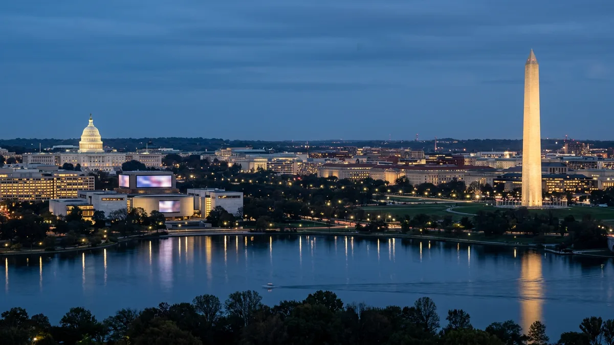 The Washington DC skyline at blue-hour dusk with the Capitol dome, the Washington Monument, and the tidal basin, the metro region KORE1 serves for cybersecurity staffing