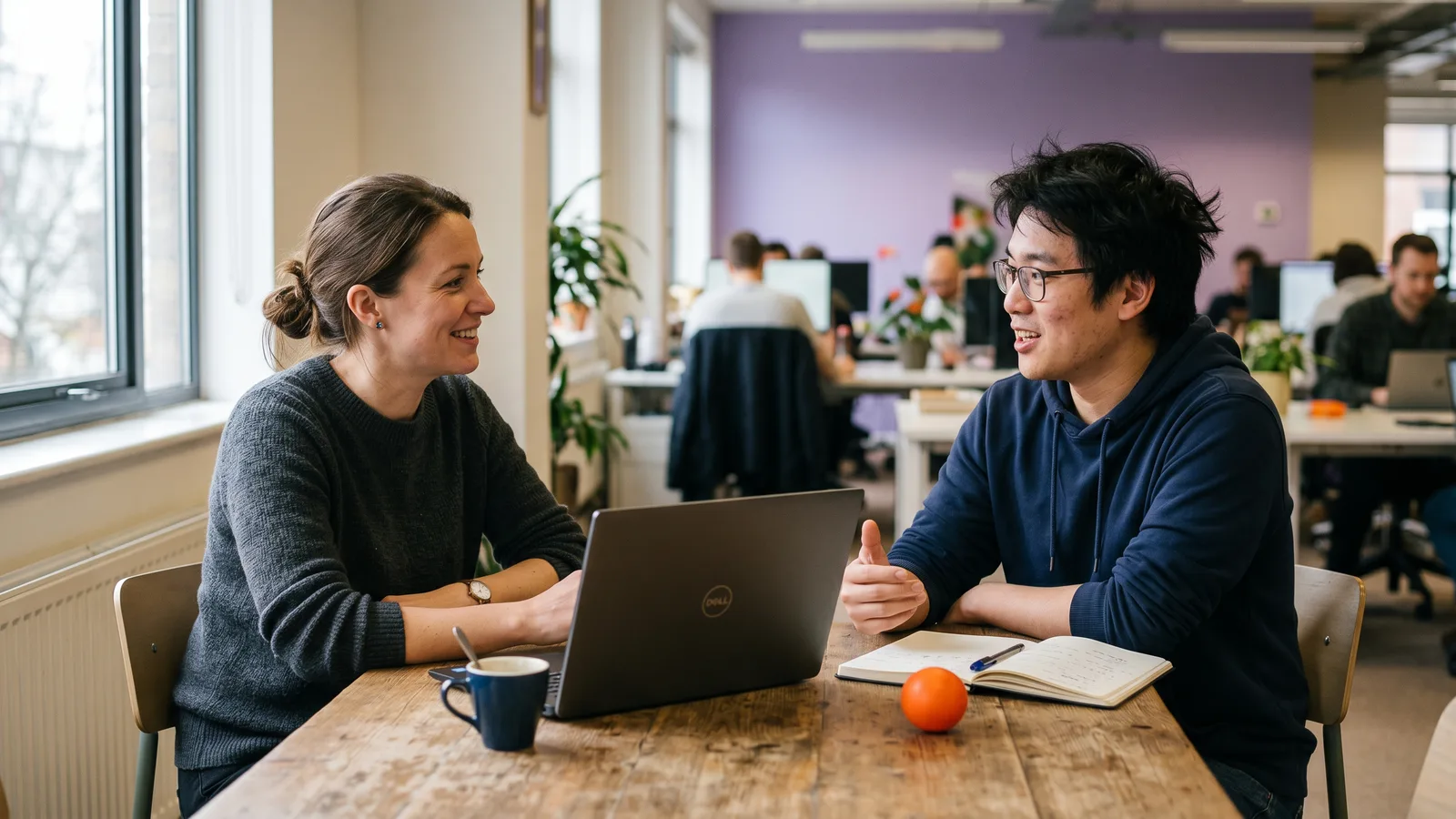 KORE1 MLOps recruiter meeting a machine learning engineer candidate in a bright modern office