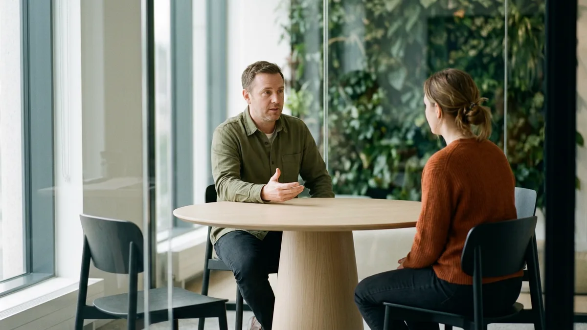 Hiring manager asking a penetration tester candidate an interview question across a round table